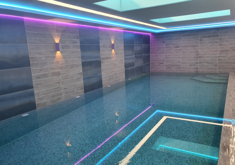 tiled polyblok pool with light features and ceiling windows