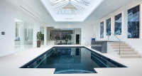 Indoor Pool with dark liner and light surrounding slabs