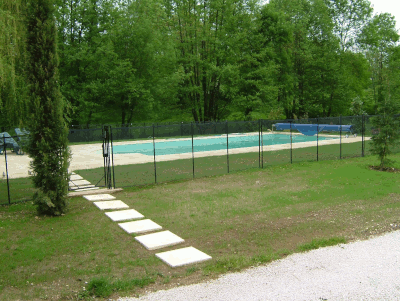 Inground Pool With Adjacent Stream Requires Drainage Systems